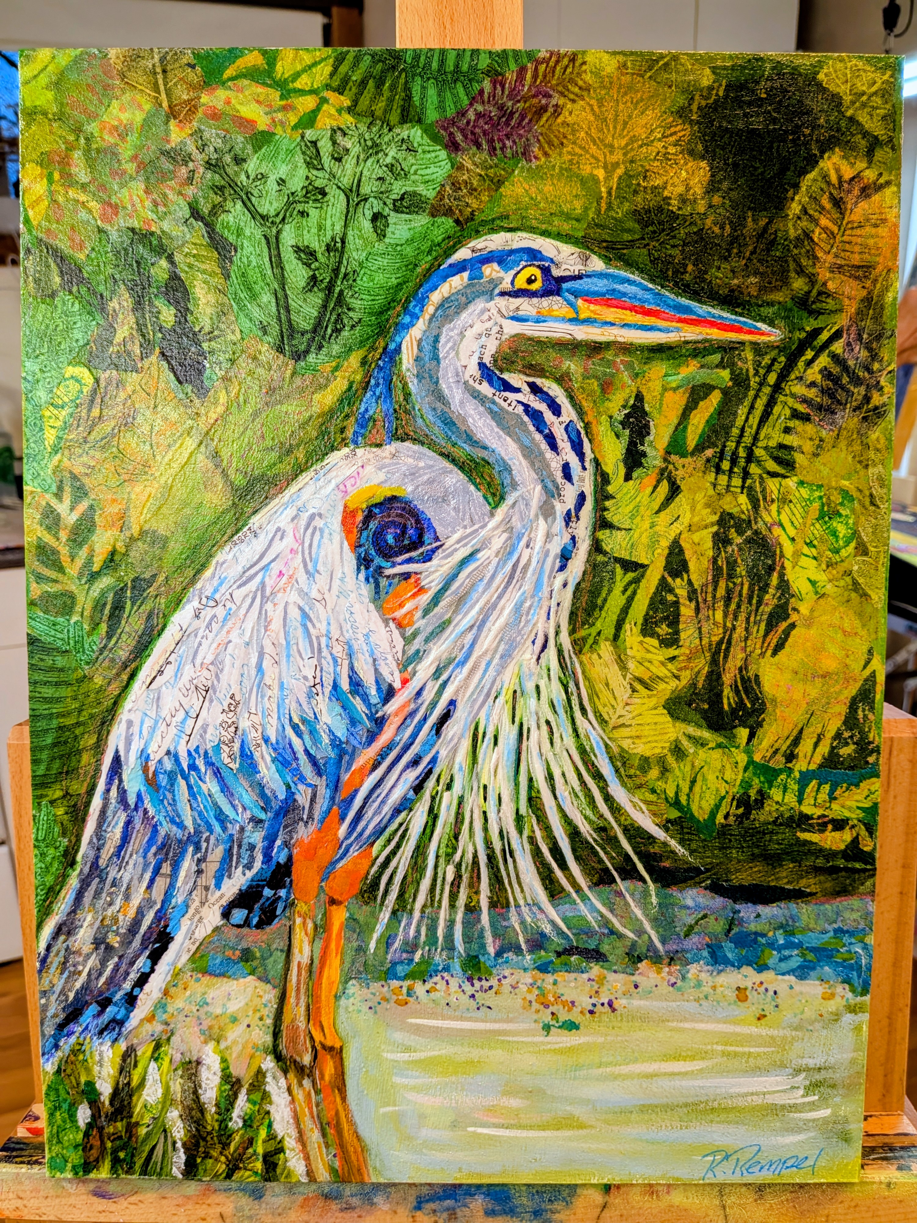 Collaged heron standing beside a pond framed by layered green foliage